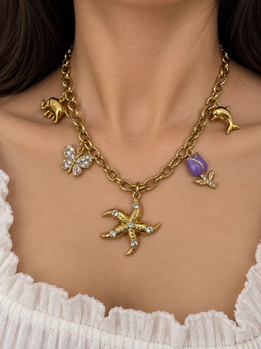 White butterfly with purple tulip charm necklace